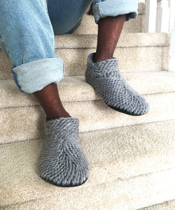 knitted crochet gray home shoes for men with a grip sole and fur lining. Luxury slippers for men made with a soft non itch merino wool, leather sole and soft cozy furry shearling lining. best Handmade slipper booties  in Canada 