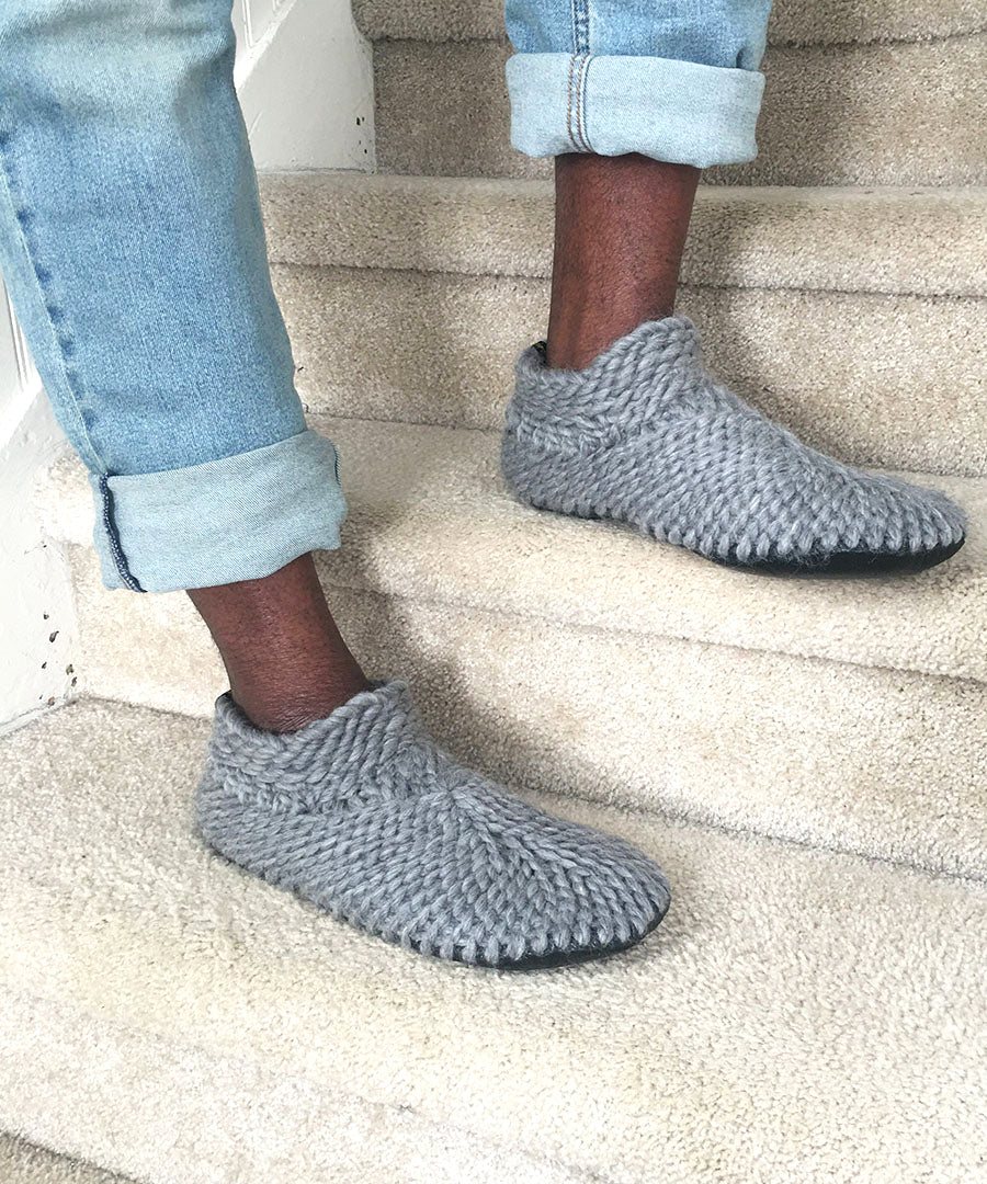 Men's gray knitted merino wool slipper booties with a grippy leather sole and furry shearling lining. Best slippers for men handmade home shoes made in Canada 