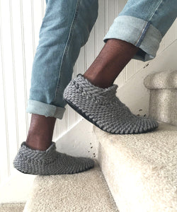 gray Padraig slippers for men. Wide slippers made by hand in Canada with soft non itch merino wool yarn. knitted woolen slippers with a grip sole and fur lining. Fur lined slippers for men handmade in Canada. adult padraigs