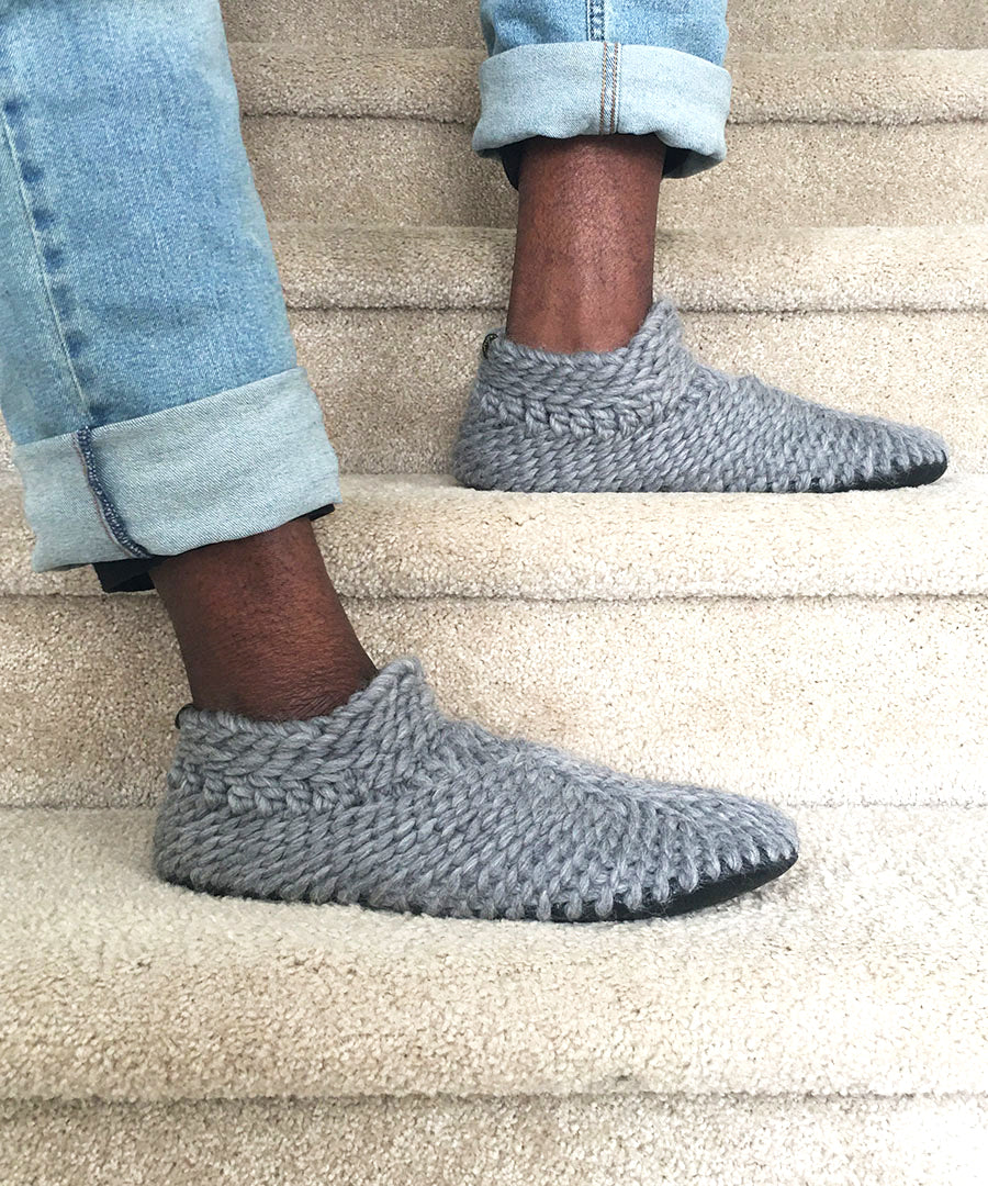 luxury mens slippers handmade in Canada. Knitted gray slipper booties for men that fit wide and have a durable leather sole with fur lining. sustainable shoe brand made by hand in canada