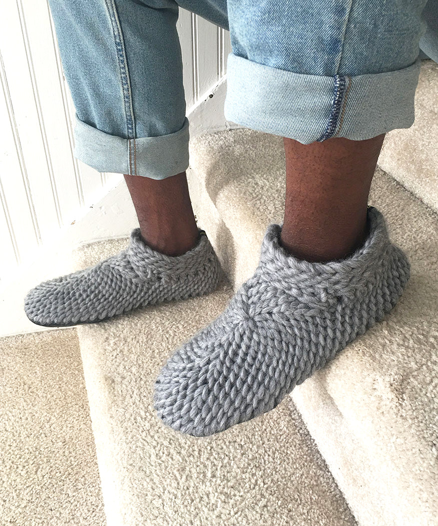 gray merino wool slippers for men. fur lined slippers with a non slip leather sole for men handmade in Canada. Gray adult Padraig slippers for men made with non itch sustainable merino wool