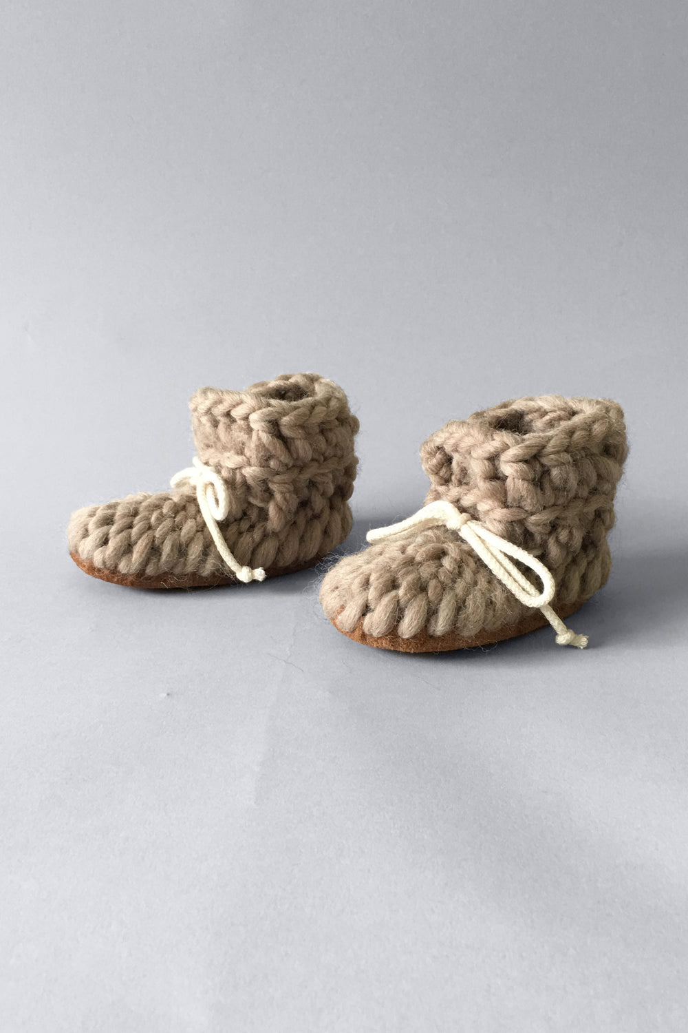 light brown wool eco friendly slippers for baby and children, handmade in Ontario, Canada. Soft non itch wool baby booties 